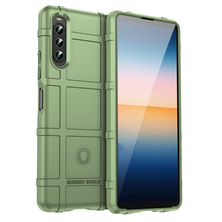 Green shockproof TPU phone case with rugged shield texture and camera cutouts