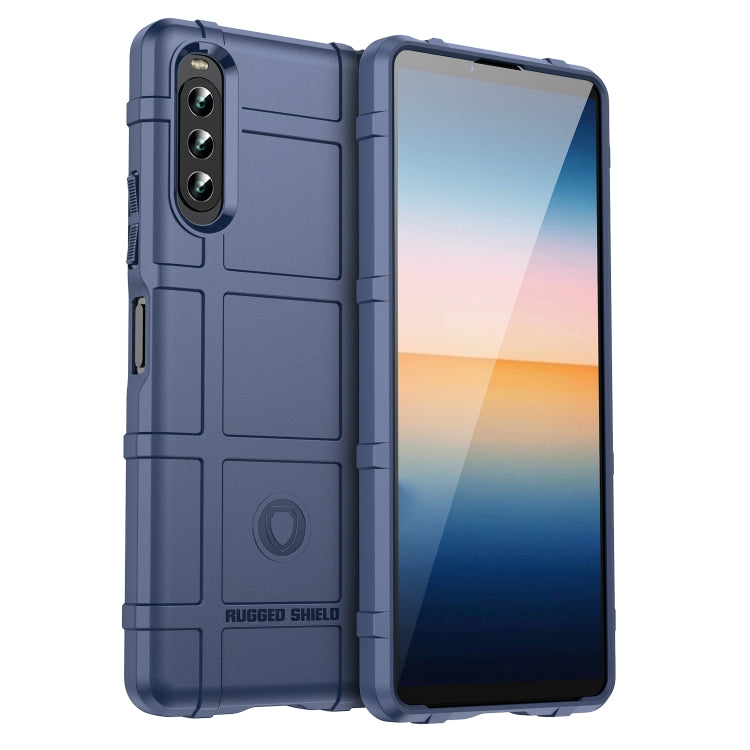 Blue shockproof TPU phone case with rugged shield texture and camera cutouts