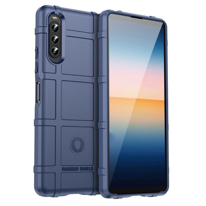 Blue shockproof TPU phone case with rugged shield texture and camera cutouts