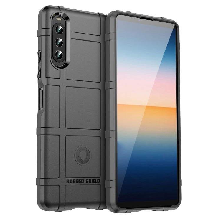 Black shockproof TPU phone case with rugged shield texture and camera cutouts