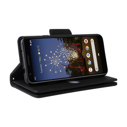 Black leather flip phone case with card slots, phone displayed, wrist strap.