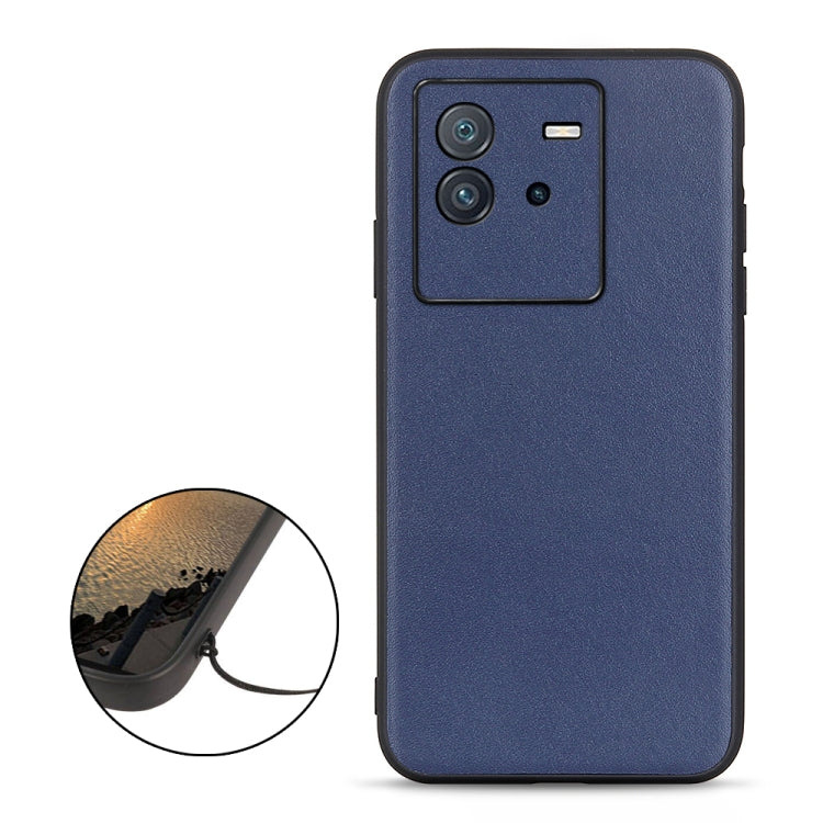 Blue genuine leather phone case with camera cutout and raised border for protection