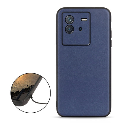 Blue genuine leather phone case with camera cutout and raised border for protection
