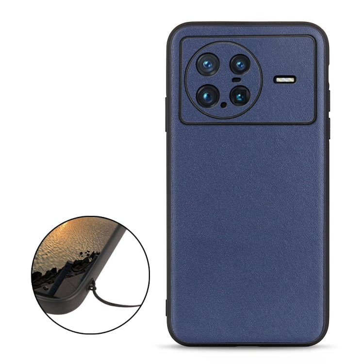 Blue genuine leather phone case featuring quad camera cutout and side button openings