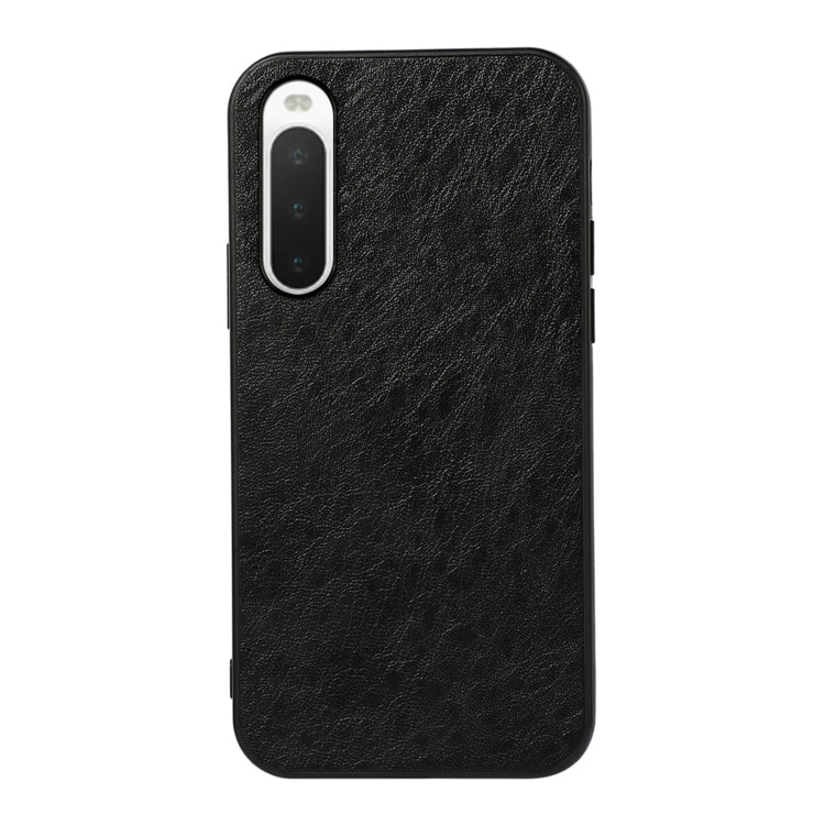 Black textured leather phone case with camera cutout and shockproof outer edges