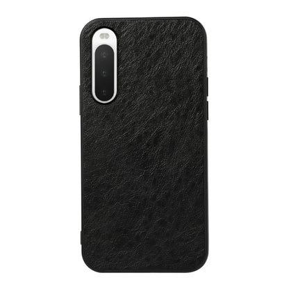 Black textured leather phone case with camera cutout and shockproof outer edges