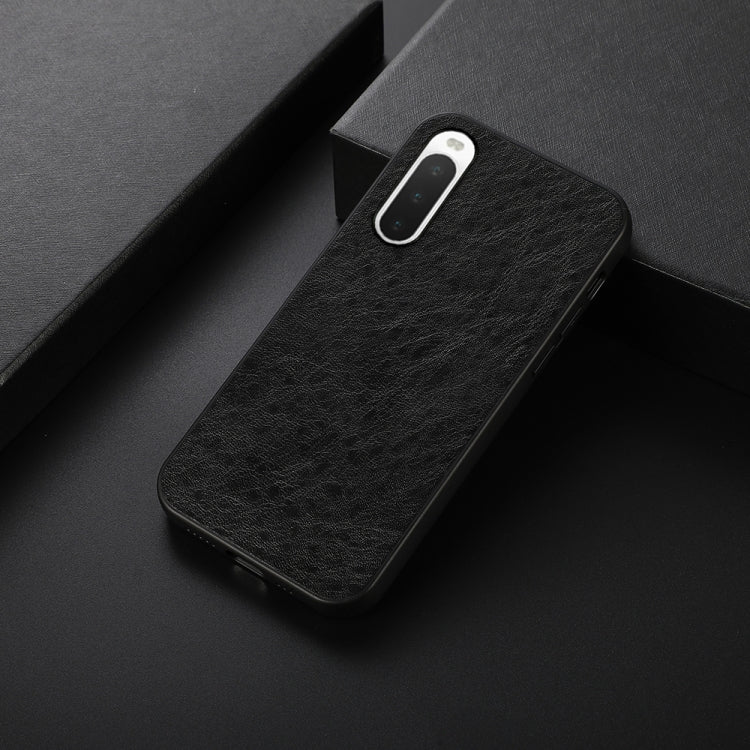 Black textured leather phone case, slim fit with camera cutout and side buttons