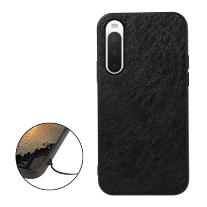 Black textured leather phone case with camera cutout; close-up inset shows fine grain