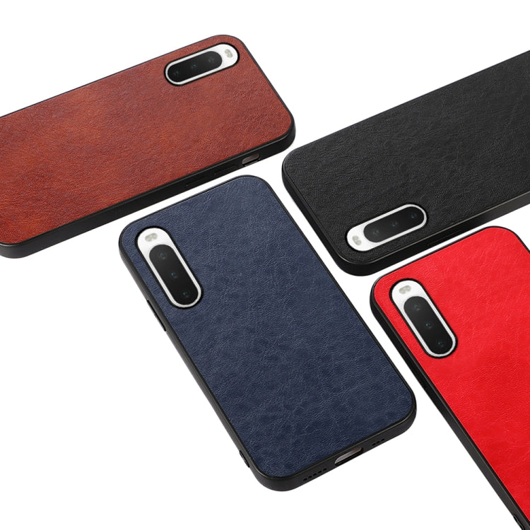 Multi-color textured leather phone cases (brown, navy, black, red) with camera cutouts