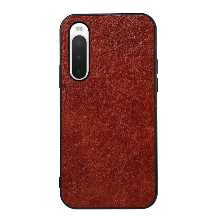 Brown textured leather phone case with camera cutout and shockproof outer edges