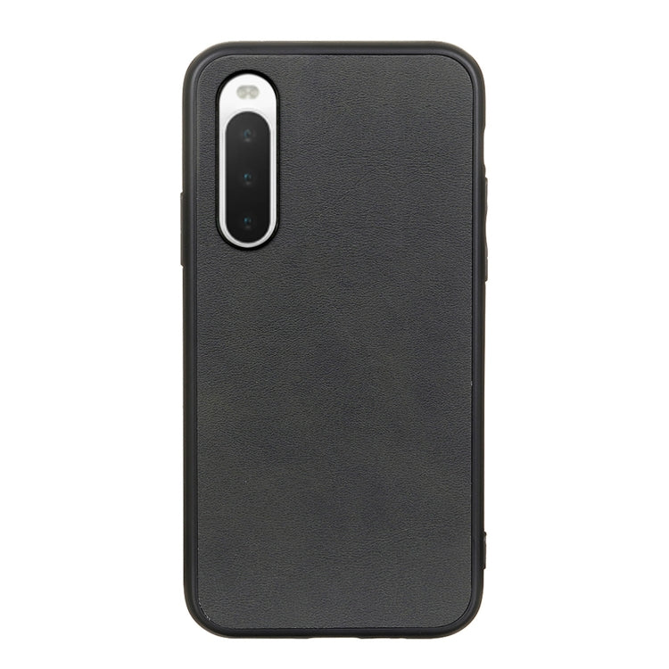 Black cowhide-texture PU shockproof phone case with cutouts for camera and ports.