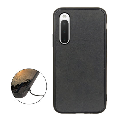 Black cowhide-texture PU shockproof phone case with protective raised edges.