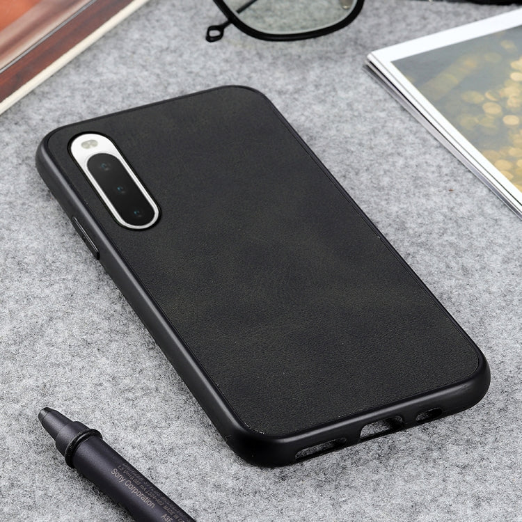 Black cowhide-texture PU shockproof phone case with side buttons and port openings.
