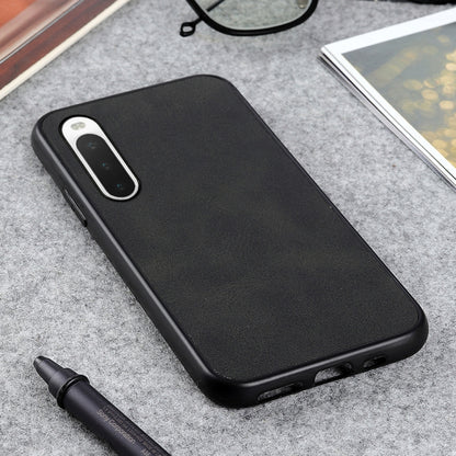 Black cowhide-texture PU shockproof phone case with side buttons and port openings.