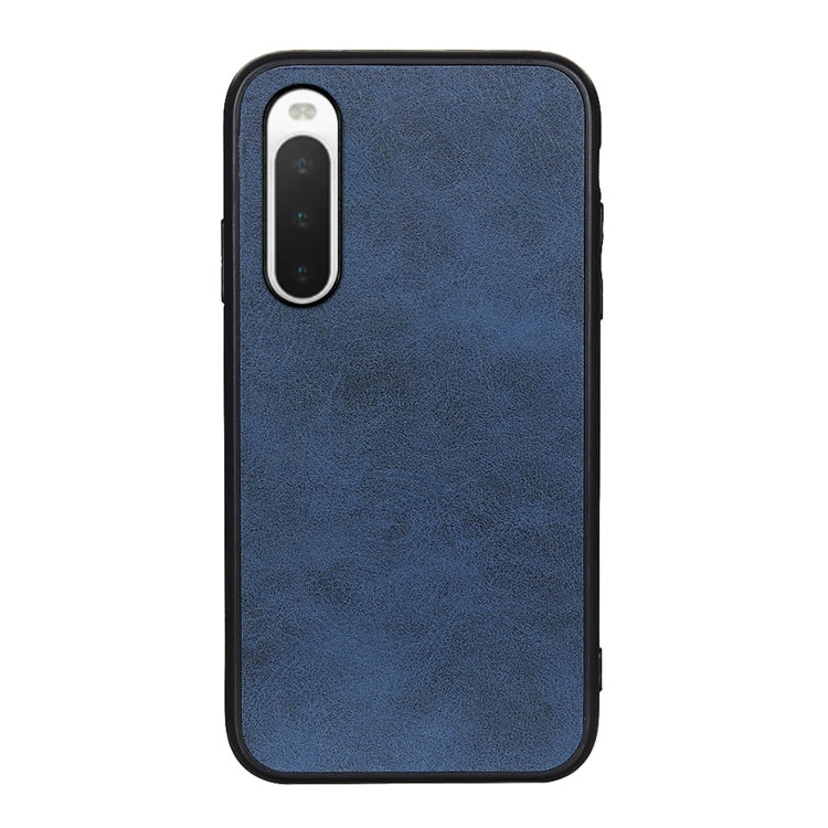 Blue cowhide-texture PU shockproof phone case with camera opening and side buttons.
