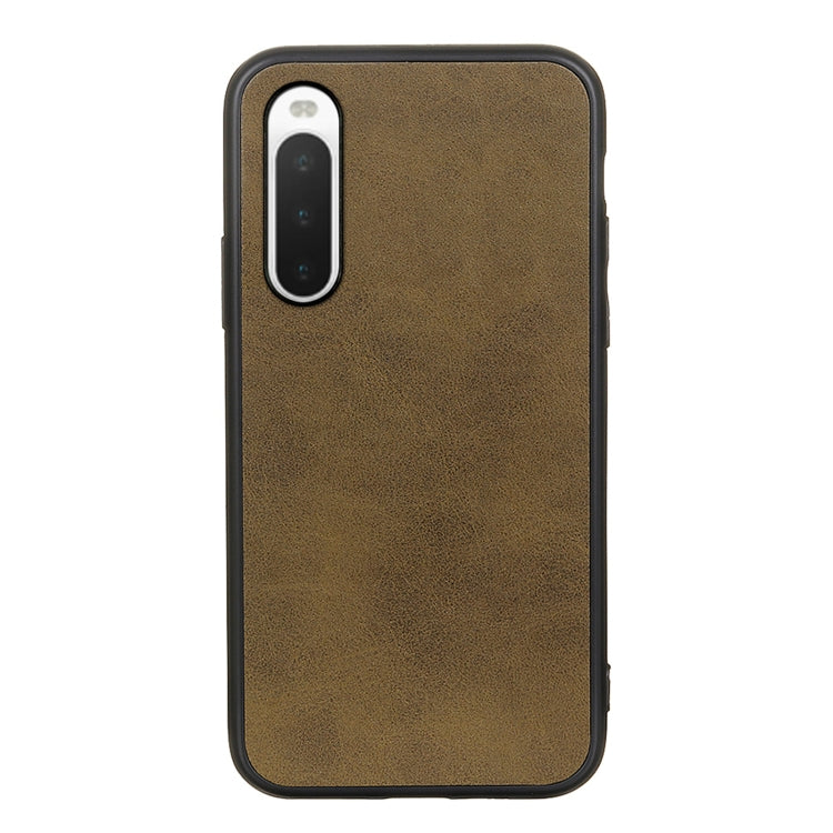 Brown cowhide-texture PU shockproof phone case with camera cutout and port access.