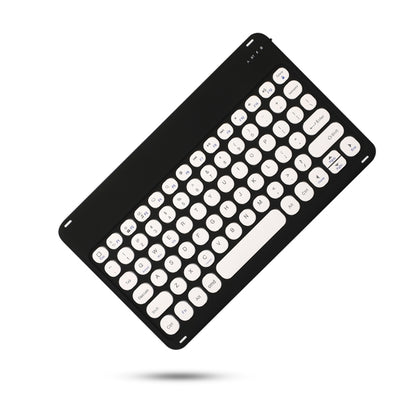 Black Bluetooth keyboard with round keys, long cutout, and corner ports