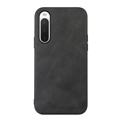 Black cowhide-textured PU phone case with front camera cutout and side buttons