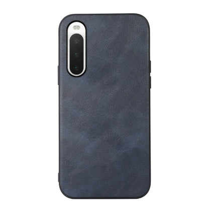 Dark blue cowhide-textured PU phone case with front camera cutout and side openings