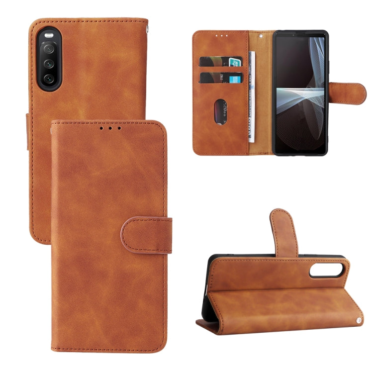 Brown magnetic flip leather phone case with card slots and fold-out stand