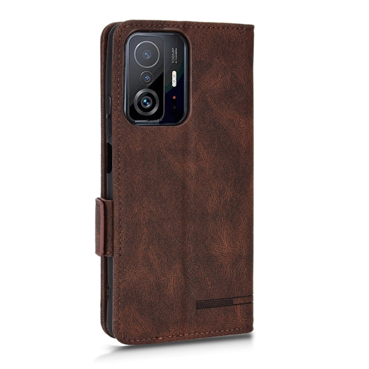 Brown leather flip phone case with camera cutout and side grip strap