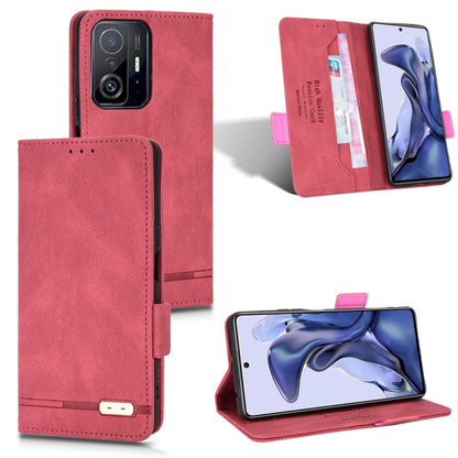 Red leather folio phone case with magnetic clasp, card slots, and kickstand