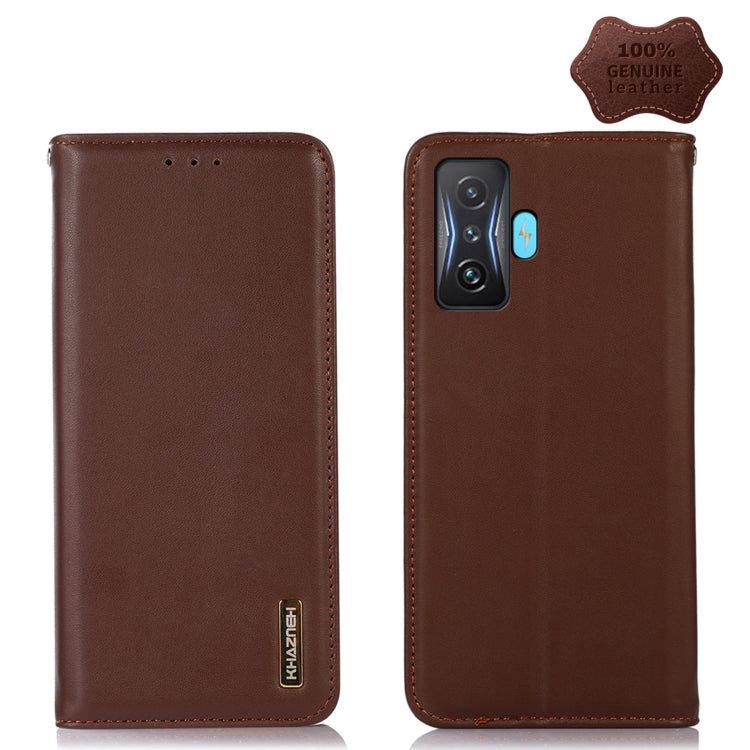 Dark brown genuine leather phone case with camera cutout and stitched edges, card slot holes