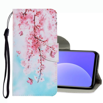 Leather phone case with cherry blossom branch print, magnetic flap, and wrist strap