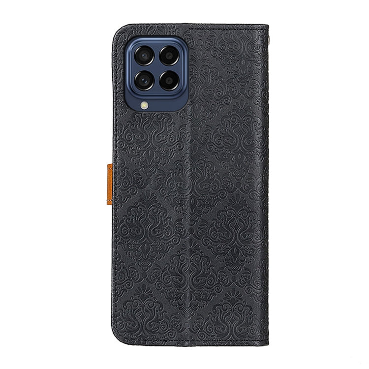 Embossed leather phone case with folio cover and camera cutout; black with brown strap.