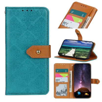 Embossed leather folio phone case with card slots and magnetic clasp; teal with brown strap.