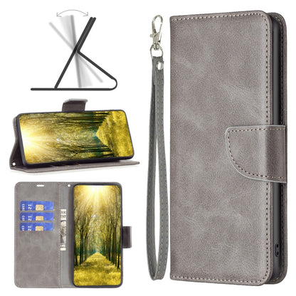 Lambskin textured leather phone wallet case in light gray with front flap and wrist strap