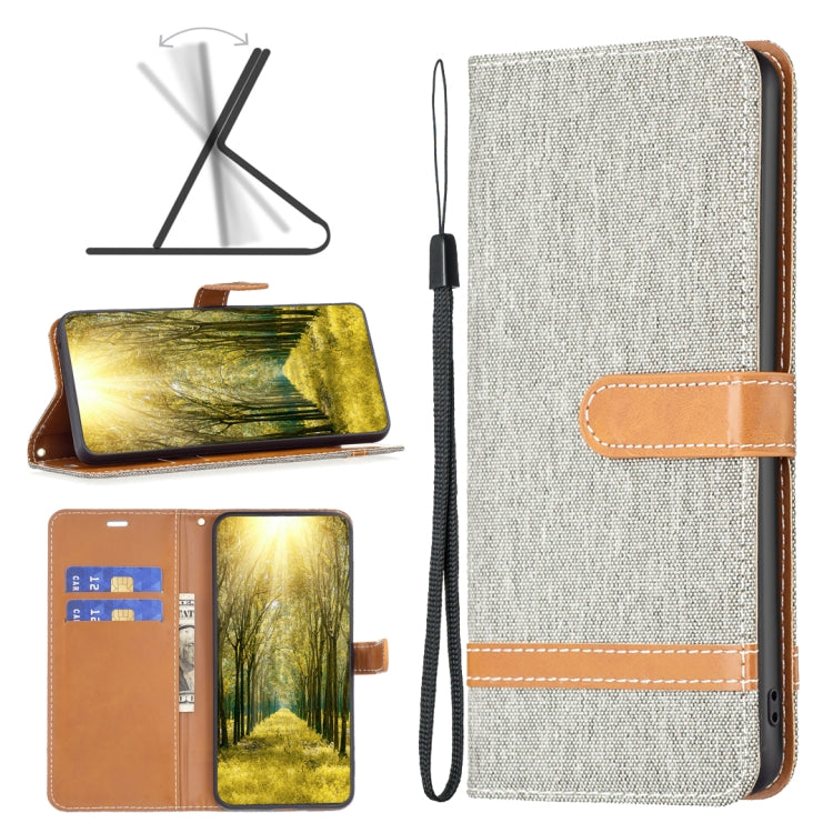 Light gray fabric-texture leather flip phone case with tan tab and wrist strap