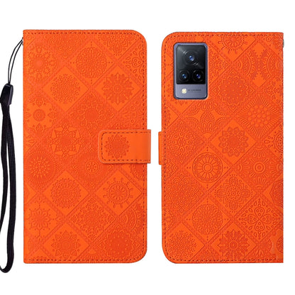 Orange embossed pattern leather-style folio phone case with wrist strap; card slot and rear camera cutout
