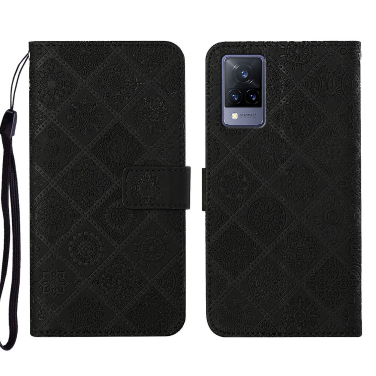 Black embossed pattern leather-style folio phone case with wrist strap; front flap and rear camera cutout