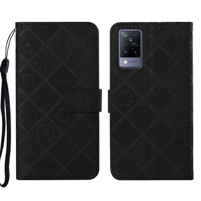 Black embossed pattern leather-style folio phone case with wrist strap; front flap and rear camera cutout