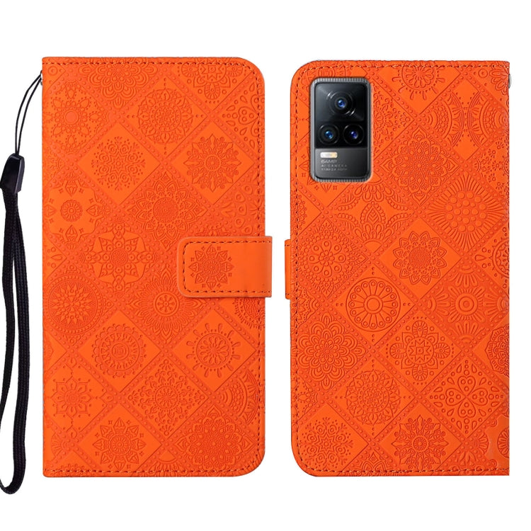 Orange embossed pattern leather-style folio phone case with wrist strap; front flap and rear camera cutout