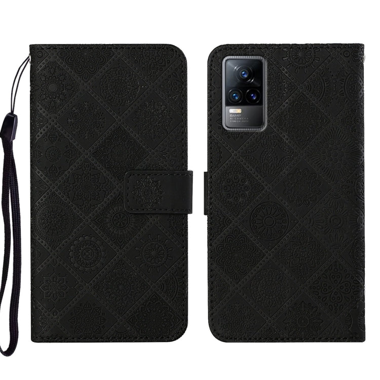 Black embossed pattern leather-style folio phone case with wrist strap; card slot and rear camera window