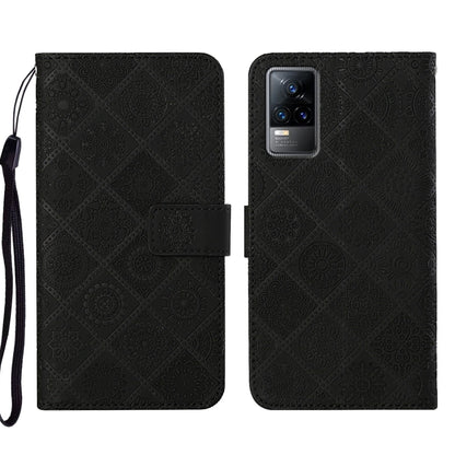 Black embossed pattern leather-style folio phone case with wrist strap; card slot and rear camera window