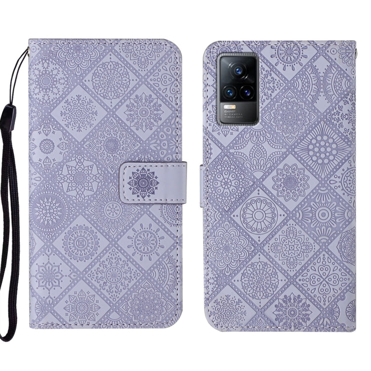 Purple embossed leather folio phone case with wrist strap and card pocket, visible camera window.