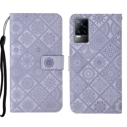 Purple embossed leather folio phone case with wrist strap and card pocket, visible camera window.