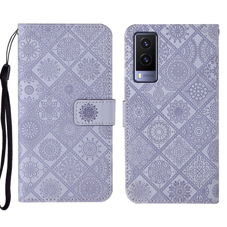 Purple embossed leather folio phone case with wrist strap, card pocket, and rear camera openings.