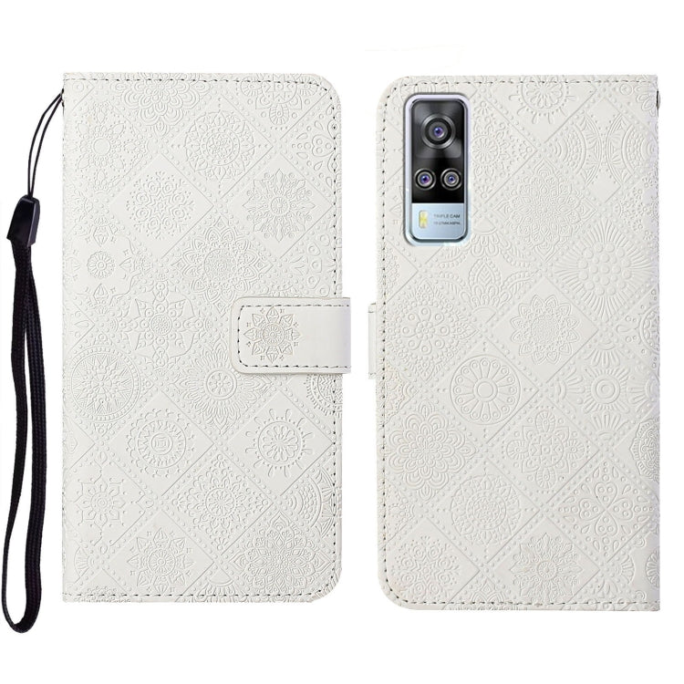 White embossed leather folio phone case with wrist strap and card pocket, phone-camera opening.