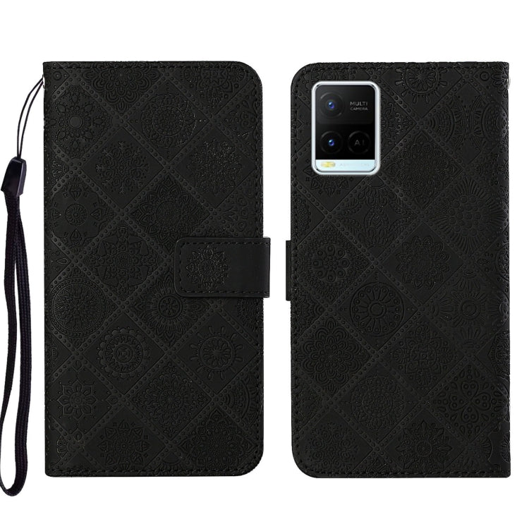 Black embossed leather folio phone case with wrist strap, magnetic flap and card pocket.