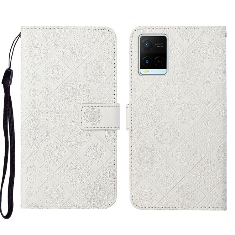 White embossed leather folio phone case with wrist strap and card pocket, patterned cover.