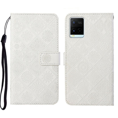 White embossed leather folio phone case with wrist strap and card pocket, patterned cover.