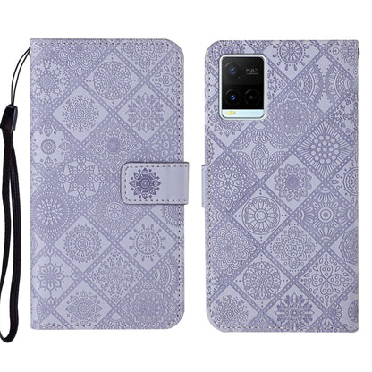 Purple embossed leather phone case with geometric floral pattern and wrist strap