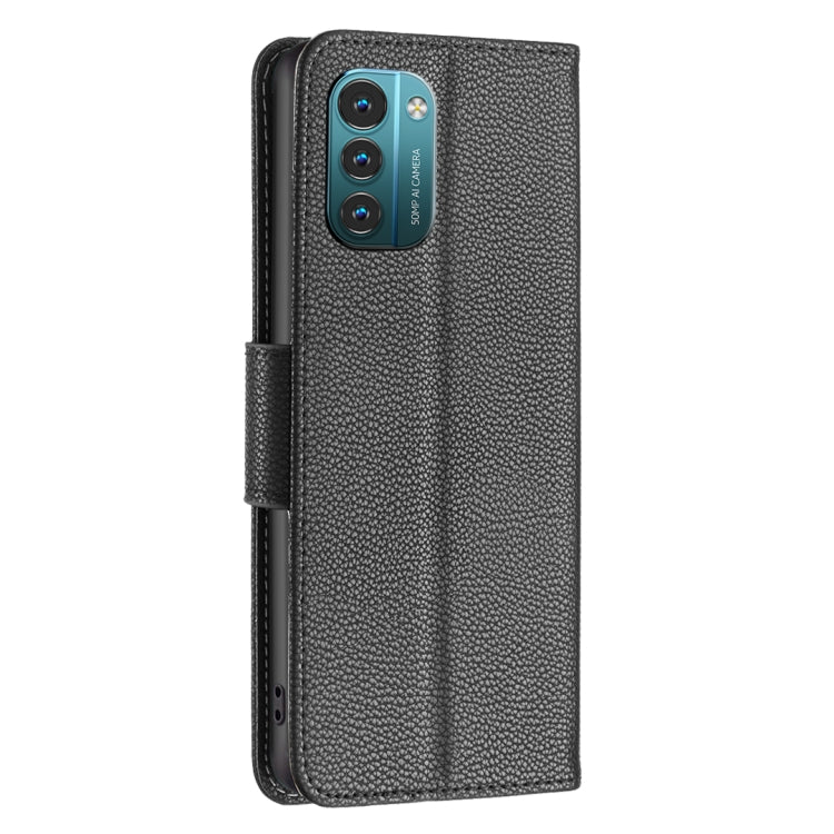 Textured leather flip phone case, black, with camera cutout and foldover strap