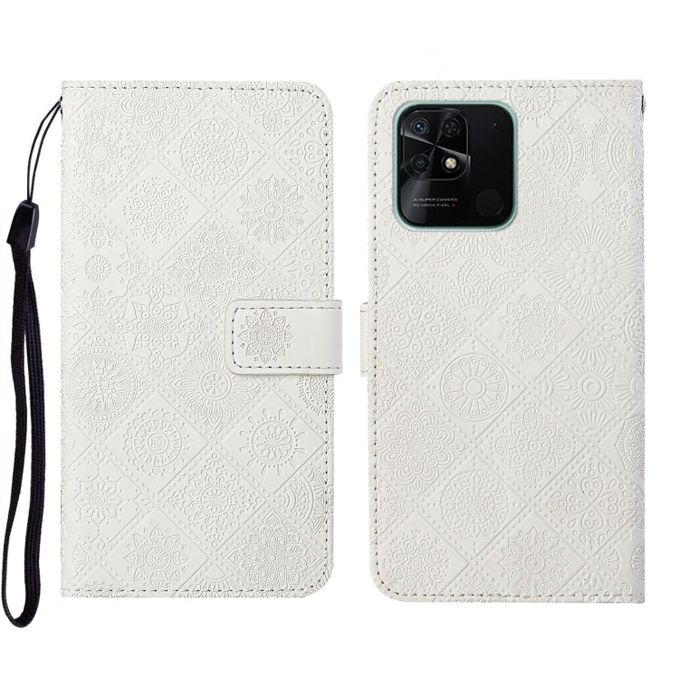 White embossed leather phone case wallet with flip cover and wrist strap, rear camera view.