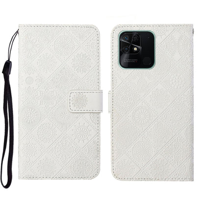 White embossed leather phone case wallet with flip cover and wrist strap, rear camera view.