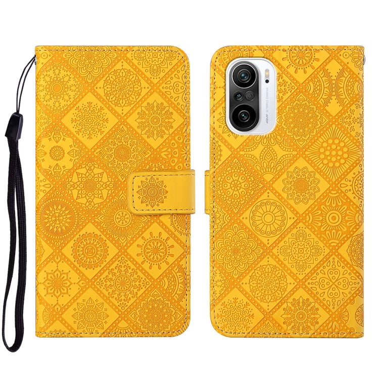 Yellow embossed leather phone case with floral pattern, front flap and camera cutout